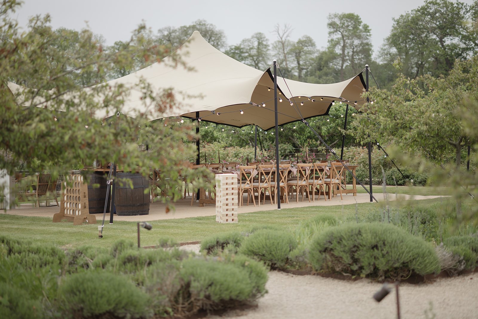 A stretch tent arranged for an outdoor celebration in Guernsey